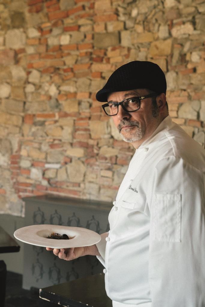 Chef Con Il Piatto Lib Castello Di Casole, A Belmond Hotel, Tuscany.jpg
